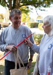 Two people outside an event chatting to each other